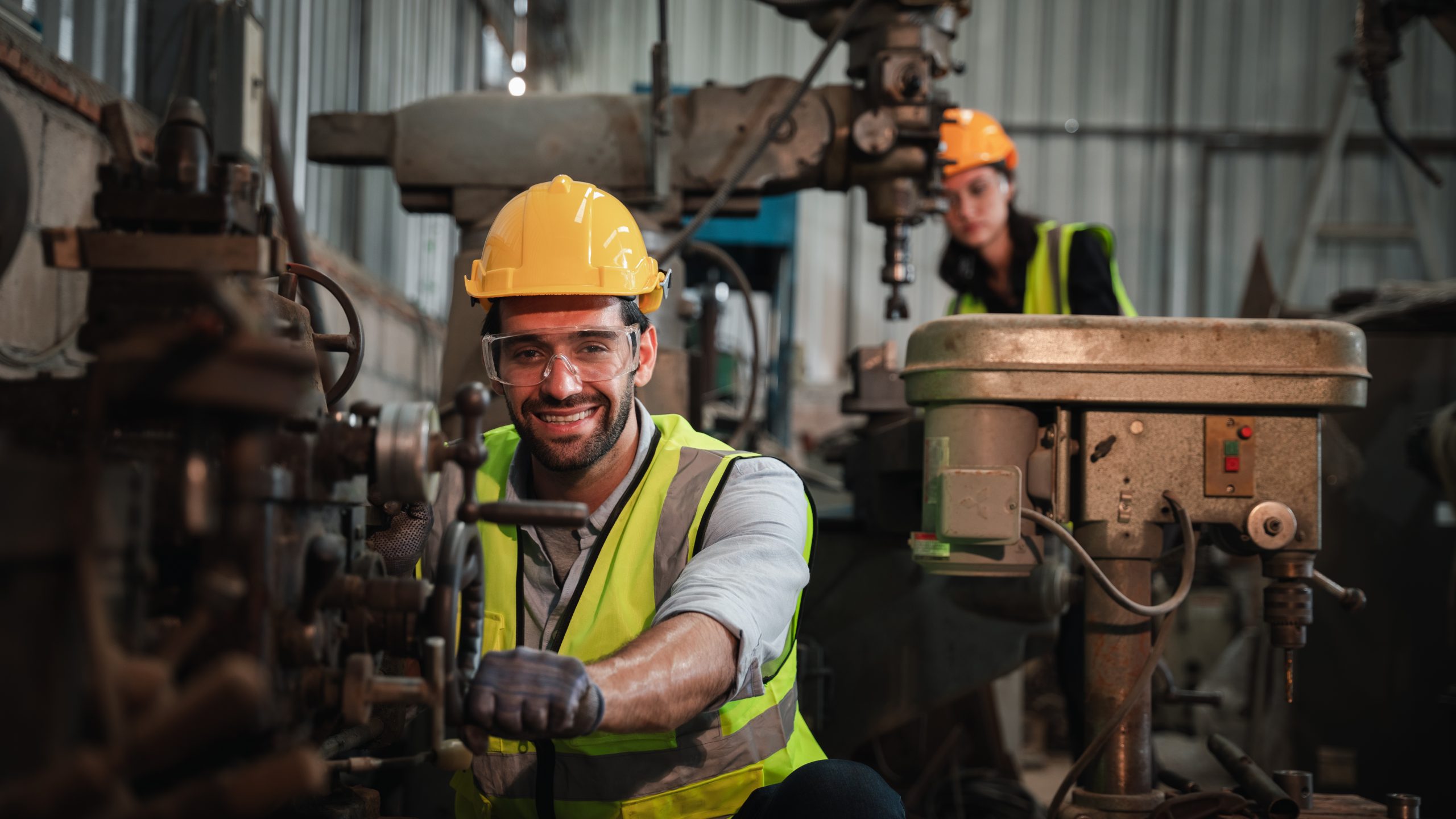 Engineer or foreman at industrial manufacturing factory check up machine or products in site.