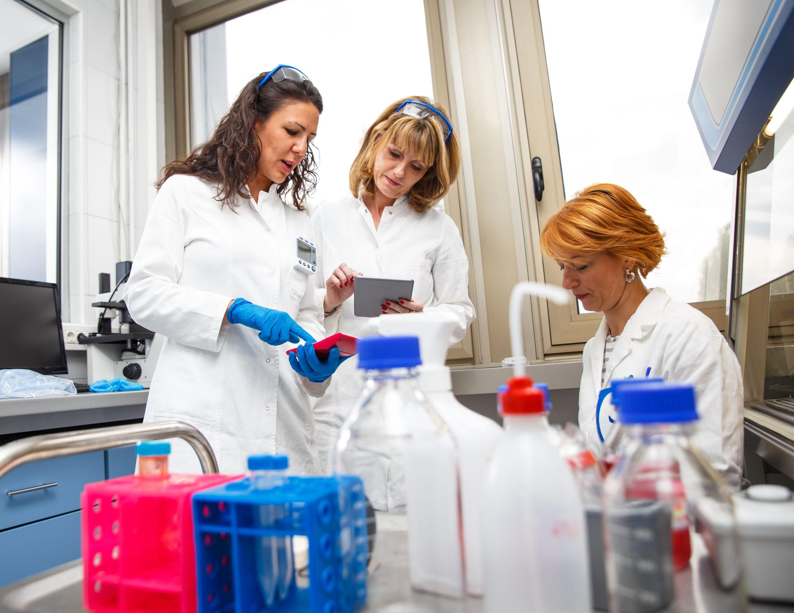 Photo of real female scientists researching in laboratory.