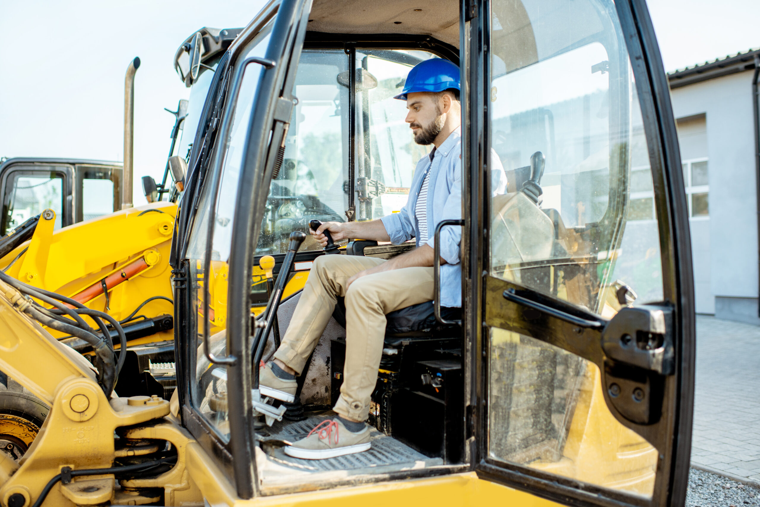 Builder choosing new machinery for construction at the shop