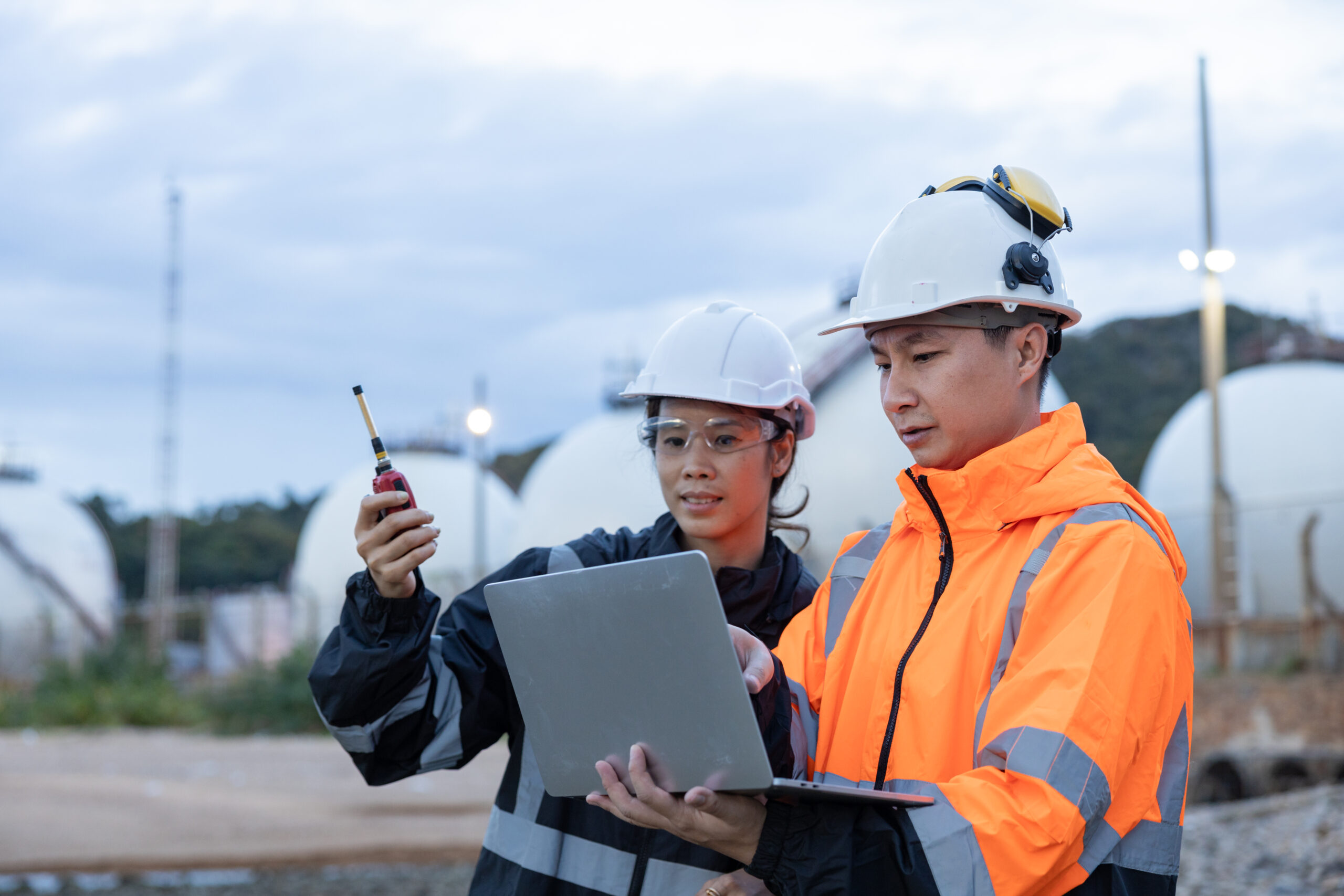 Engineers Discussing Operations at Gas Facility
