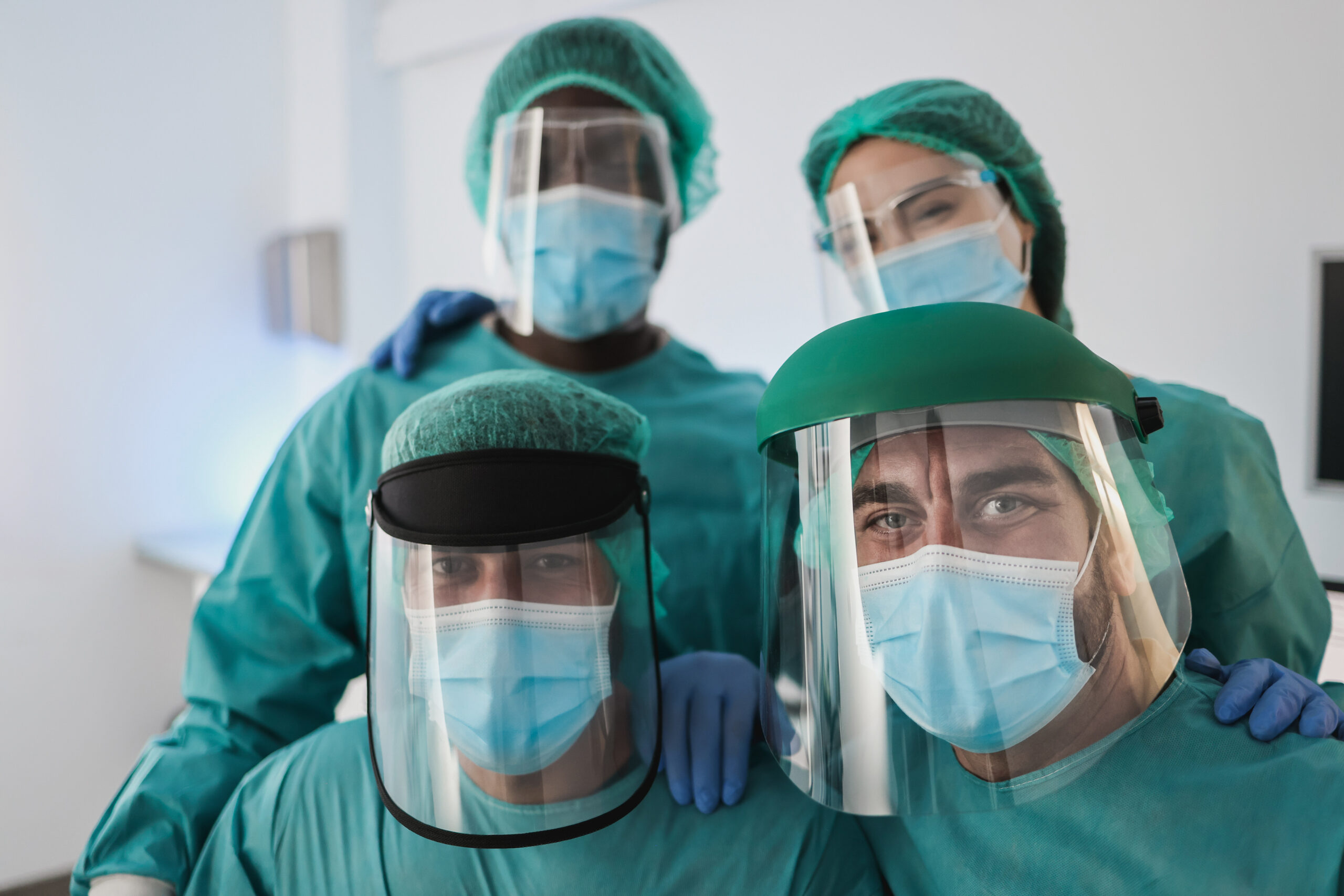 Portrait of medical doctors looking at camera inside laboratory