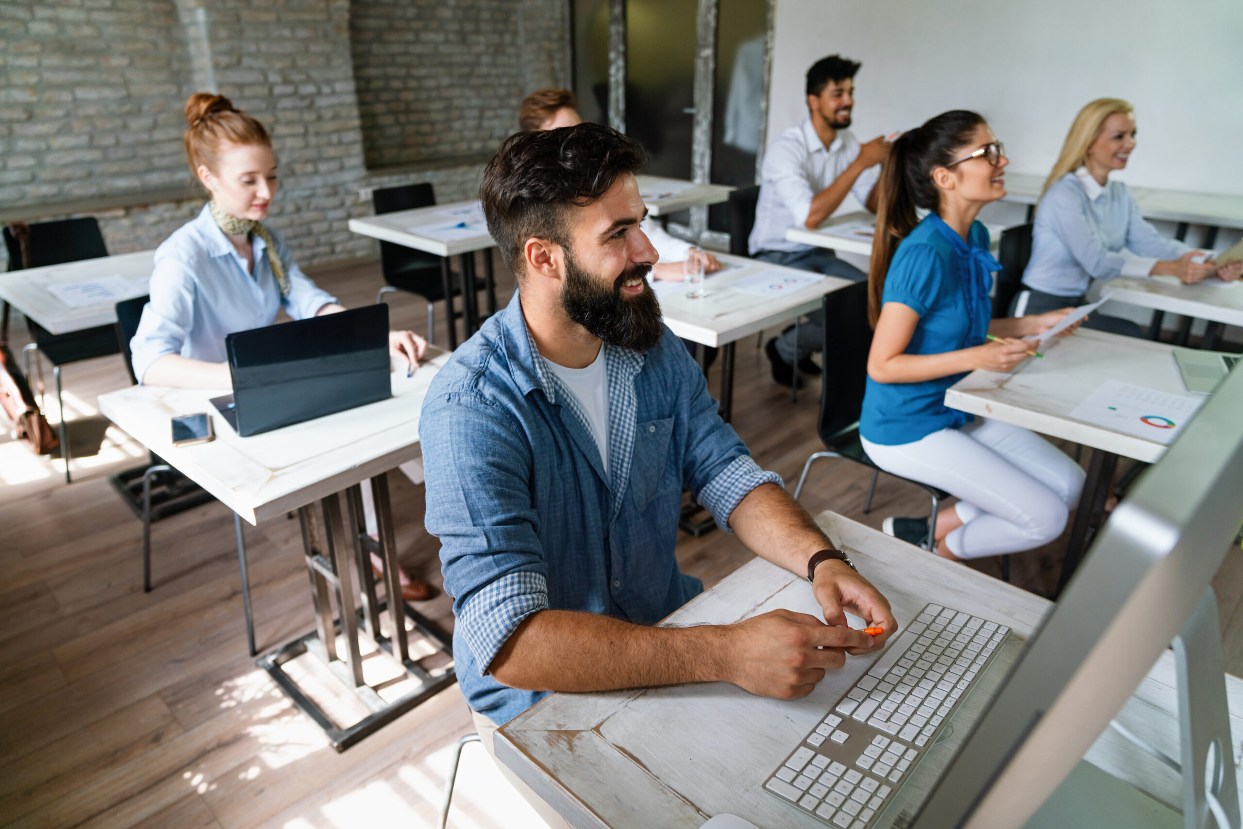 Business people having fun, teamwork and chatting at workplace startup designer office together.