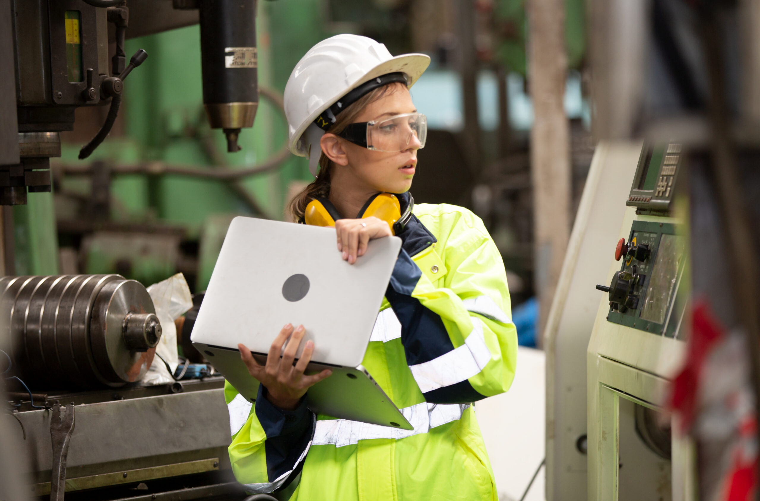 portrait of foreman or worker are working in factory.