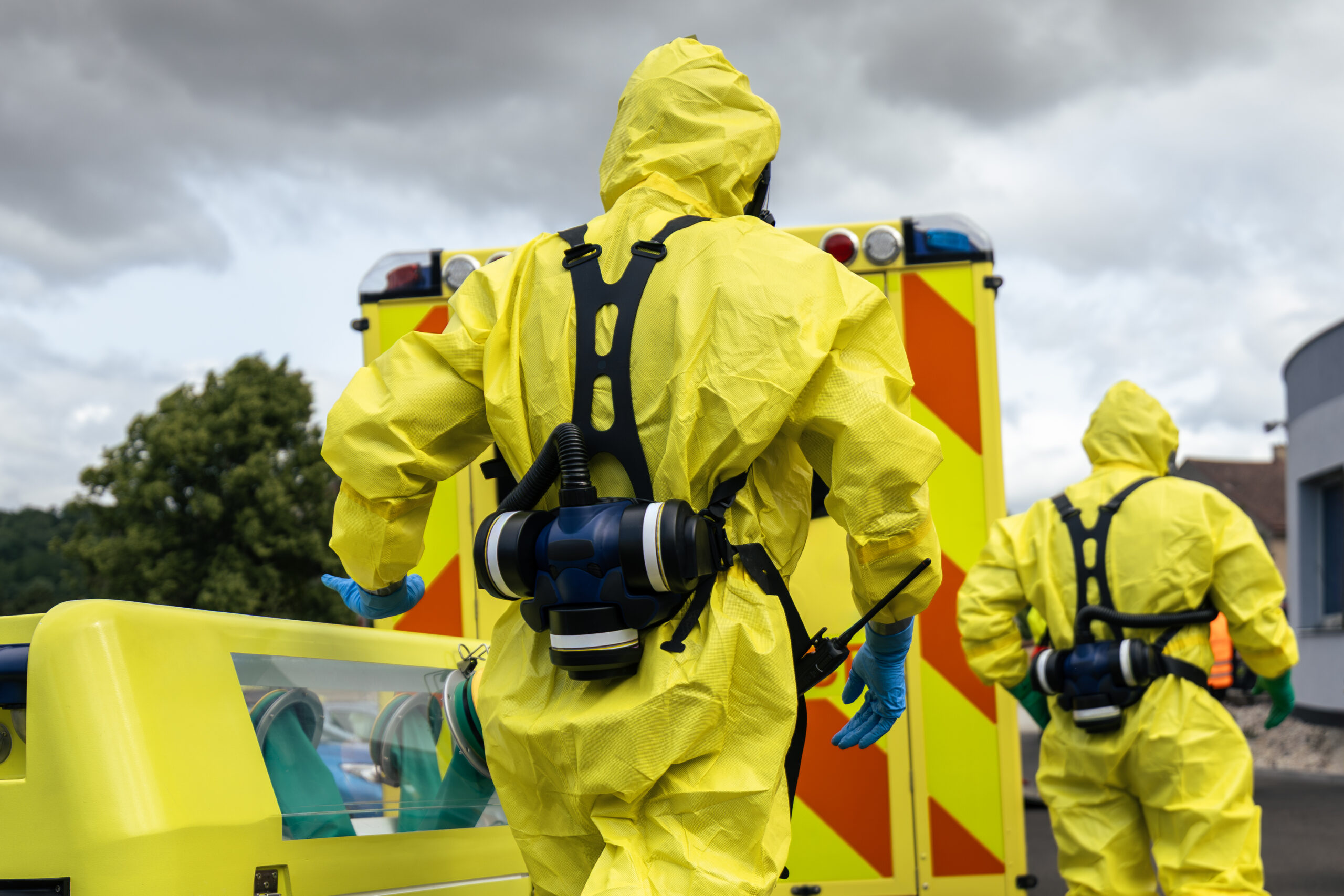 Biohazard team of emergency medical service in protective suits