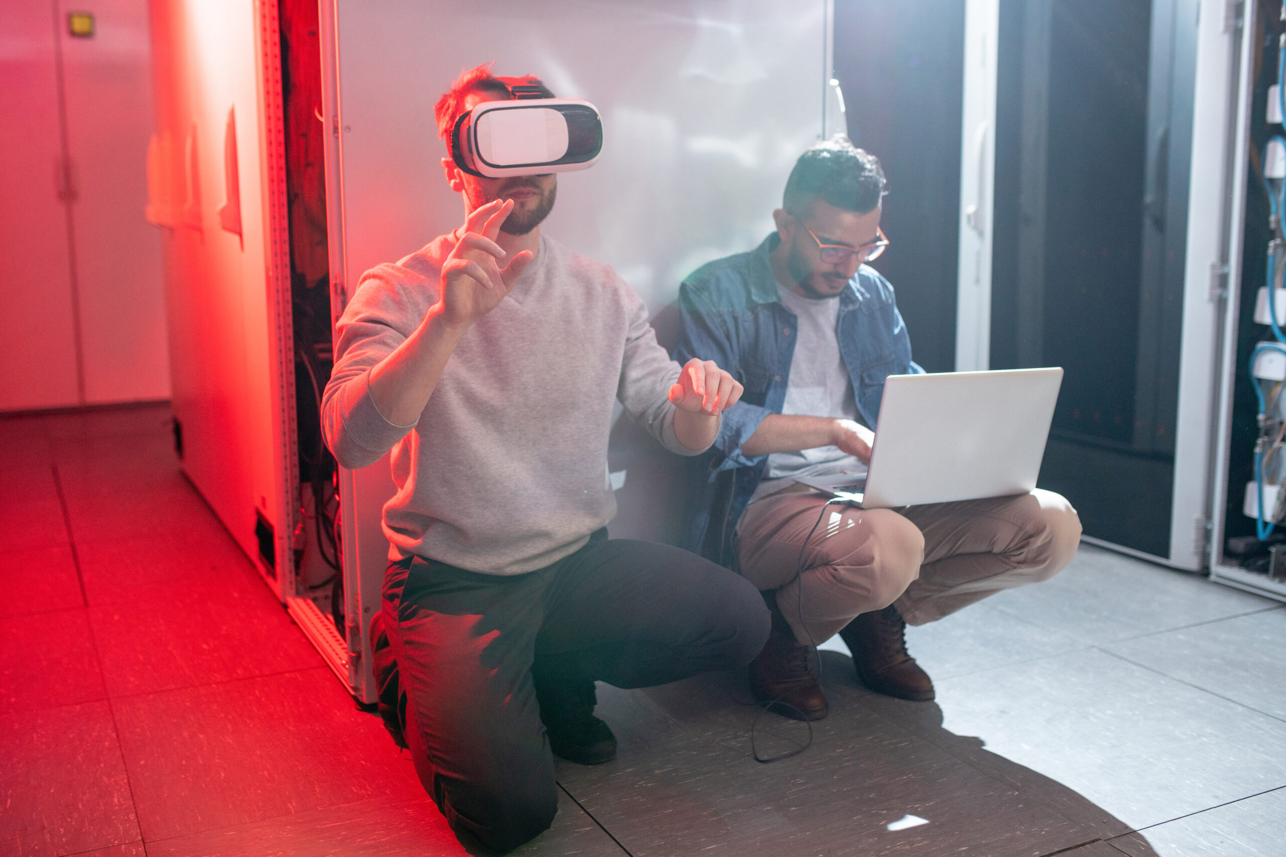 Staff of IT company in server room