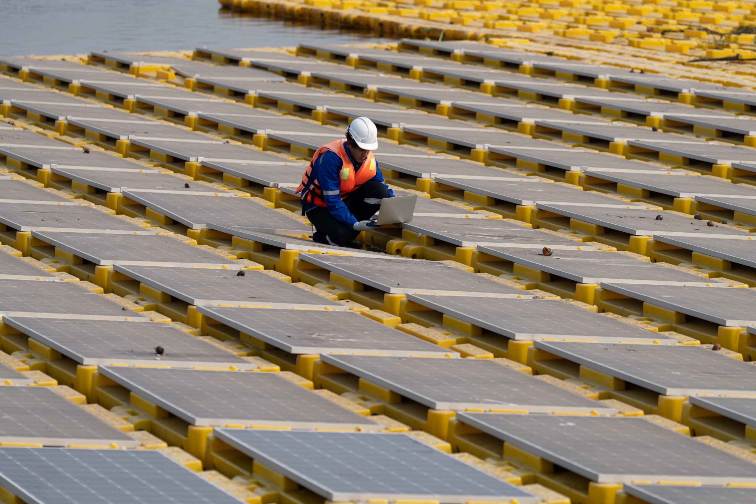 Renewable Energy Eco Technology Electric Power. Floating solar panels on lake.